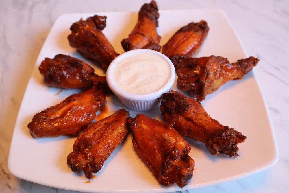 Buffalo wings with a side of ranch dressing